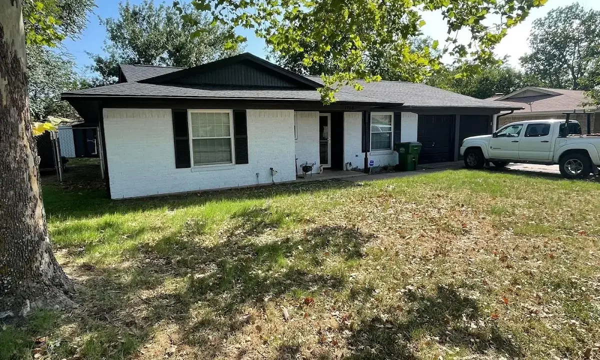 Professional roofing crew working on a residential roof in Porter